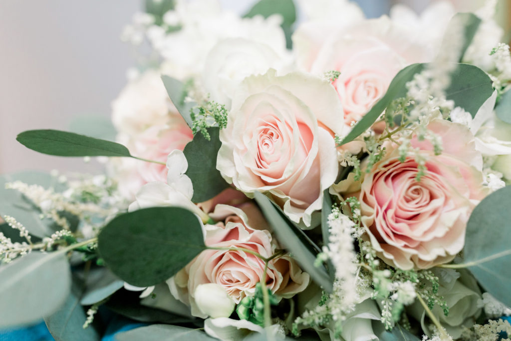 Soft pink roses in a beautiful bouquet for a summer wedding